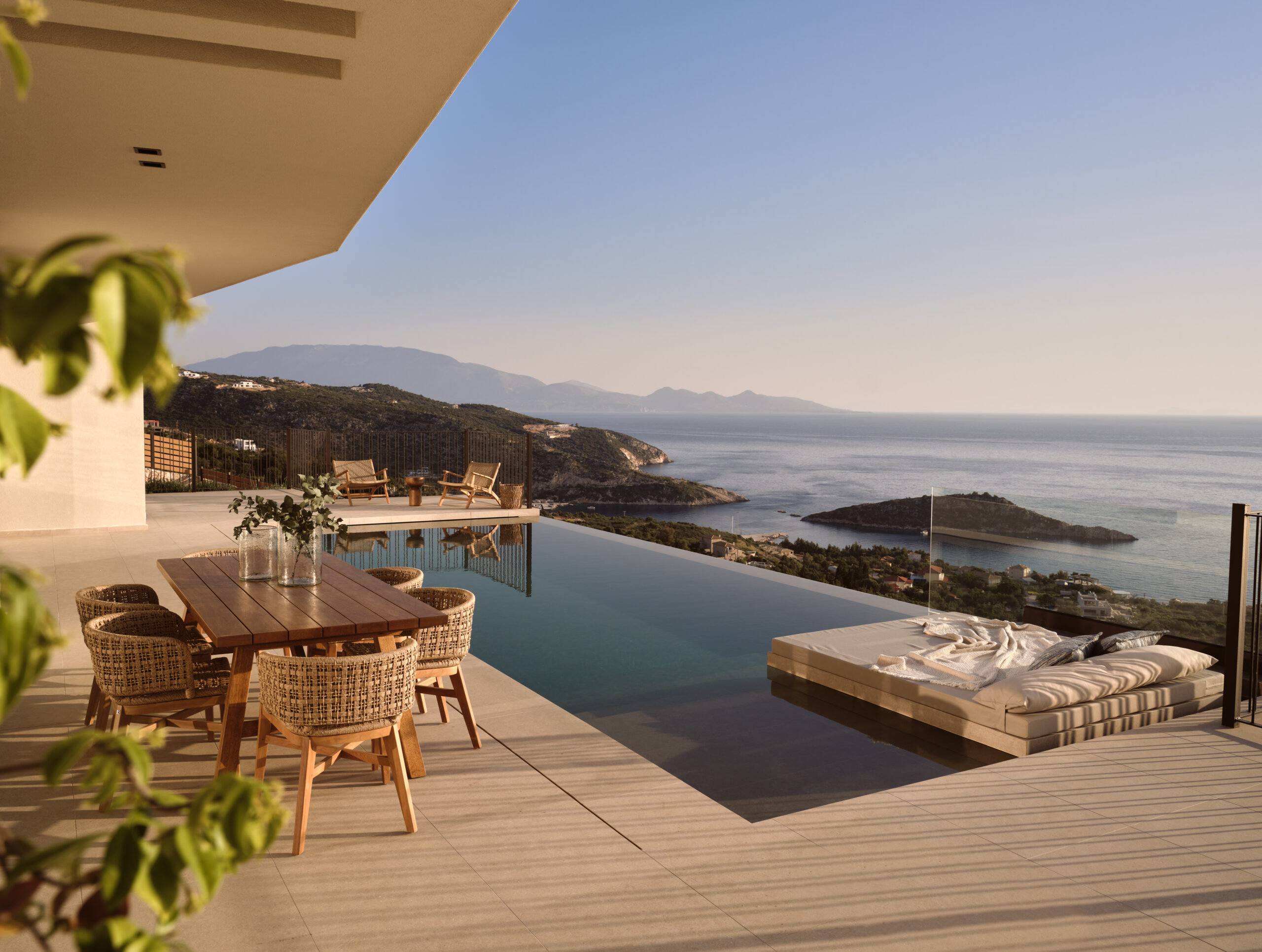 Luxury summer villa terrace with sea view and a refined outdoor dining setup